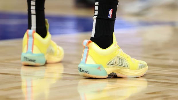 View of yellow and blue Air Jordan shoes.